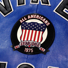 Load image into Gallery viewer, Patch on a blue background with 'All Americans' and 'Established 1975' text