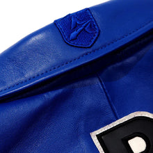 Load image into Gallery viewer, Close-up of a blue leather glove with a brand logo on a white background