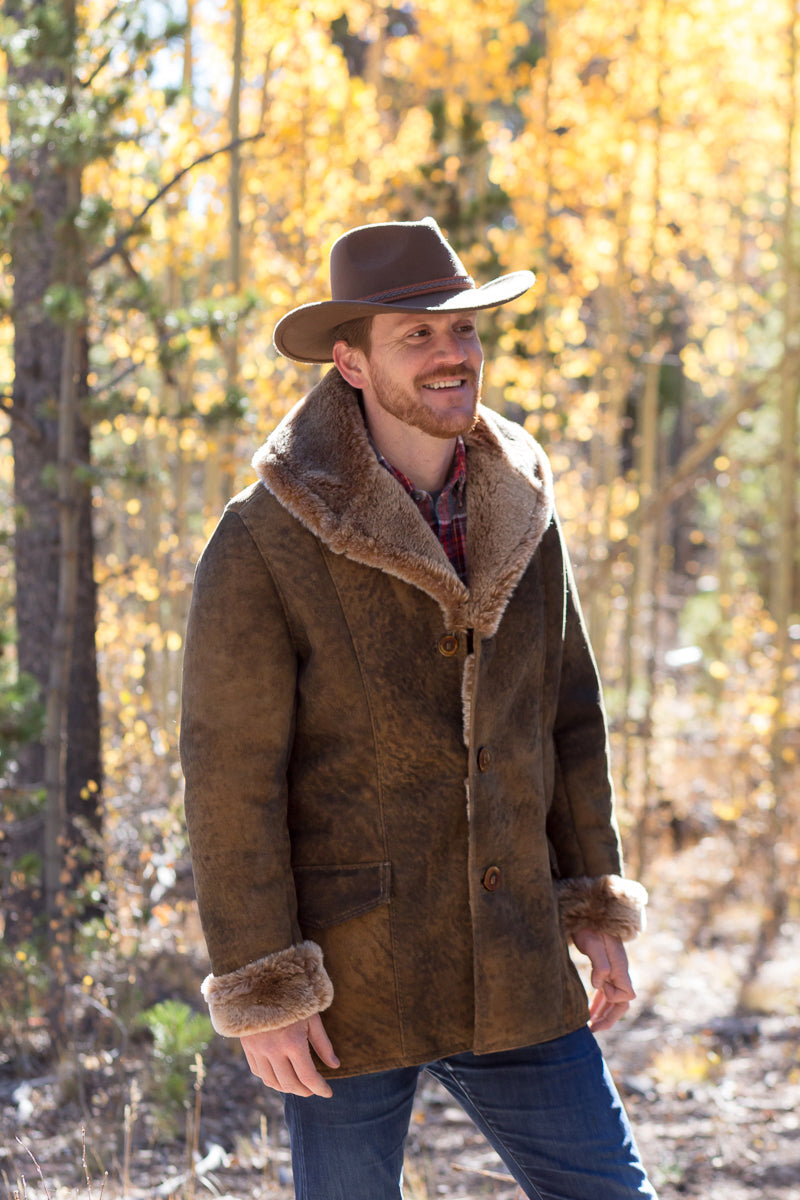 Man wearing Shearling Coat and cowboy hat