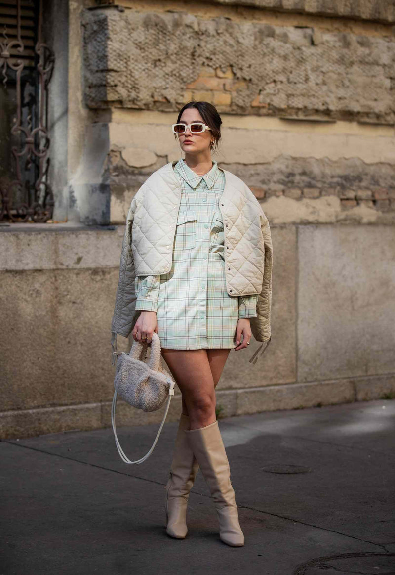 Woman Wearling White Quilted Jacket
