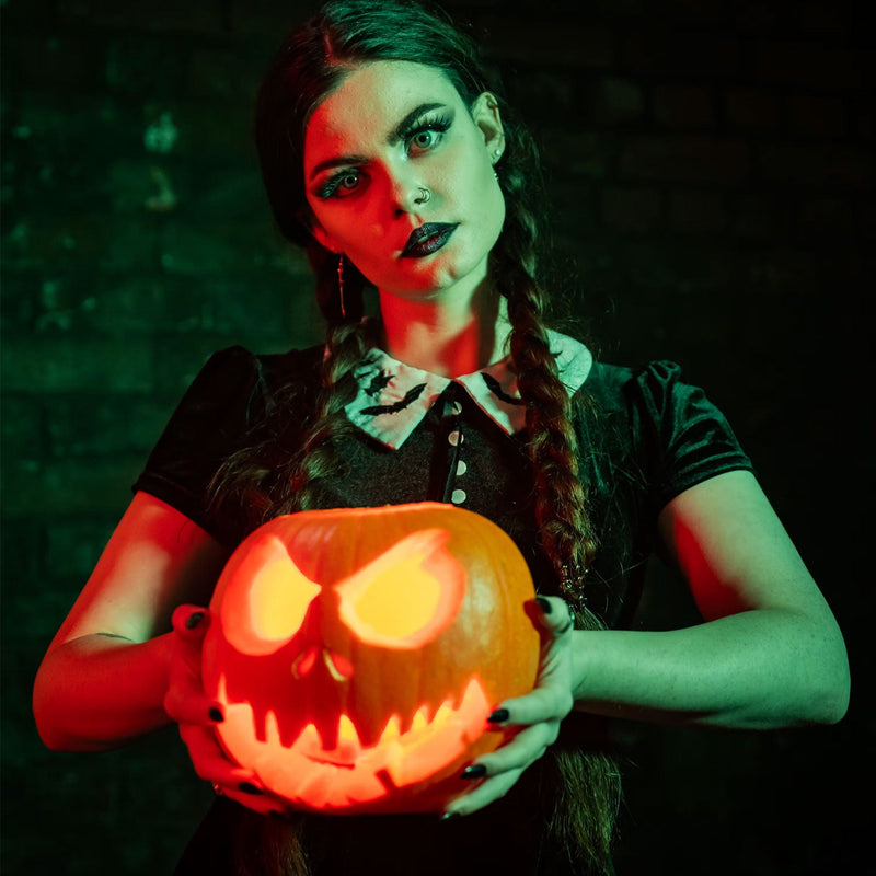 women holding pumpkin halloween theme