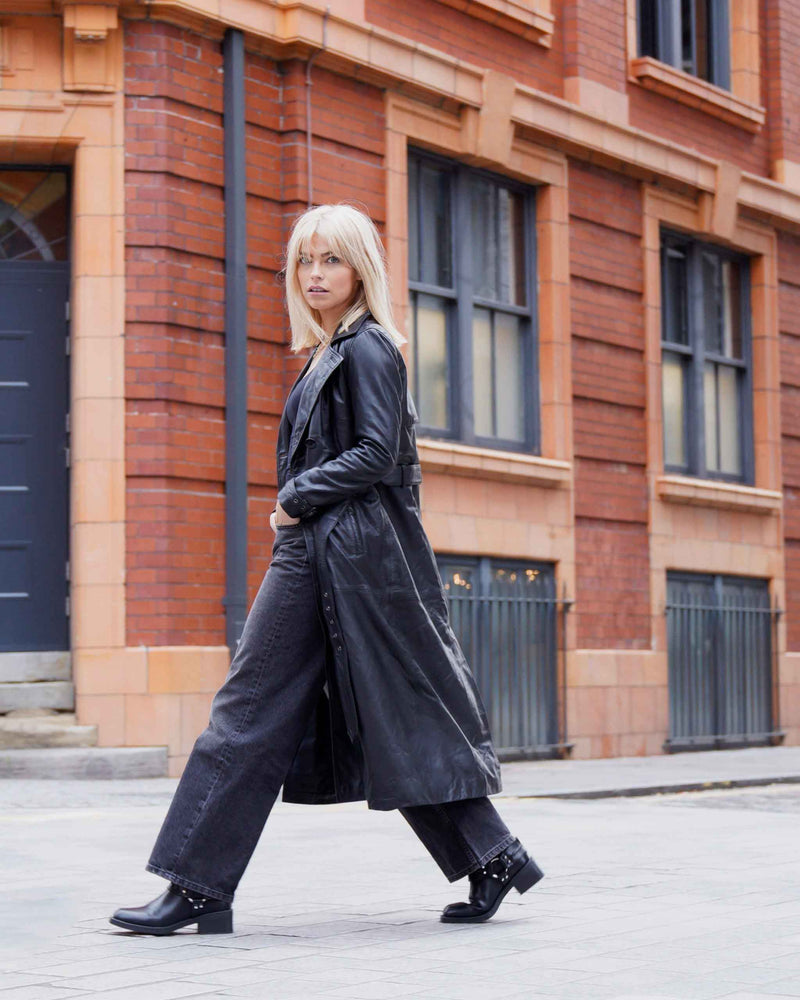 women wearing black leather trench coat