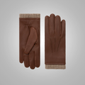 Pair of brown leather gloves with beige cuffs on a light gray background