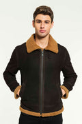 A man wearing a black aviator shearling jacket with a standing collar and zipper details.