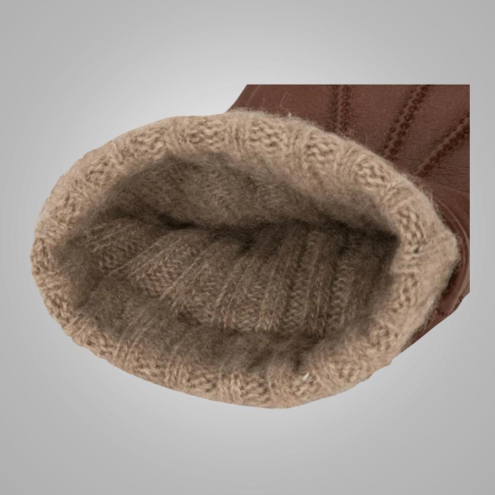 Close-up of brown knitted boot lining on a gray background