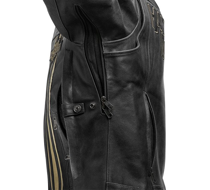 Close-up of a black leather jacket with decorative elements on a white background