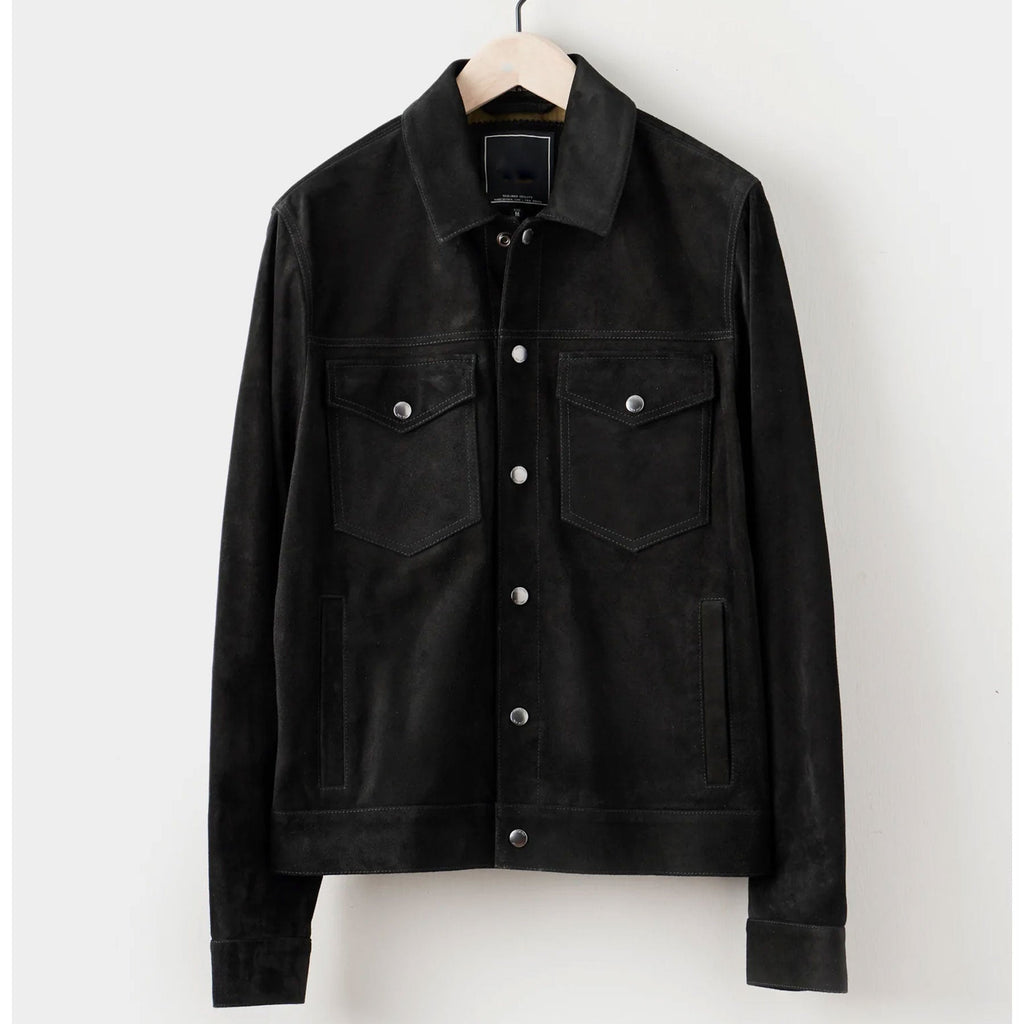 black suede leather jacket hanged on hanger.