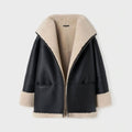 Women's black and beige aviator styled shearling leather jacket with high-standing collar and zip fastening.