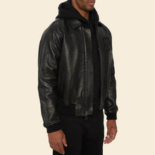 Load image into Gallery viewer, Person wearing a black leather jacket on a beige background
