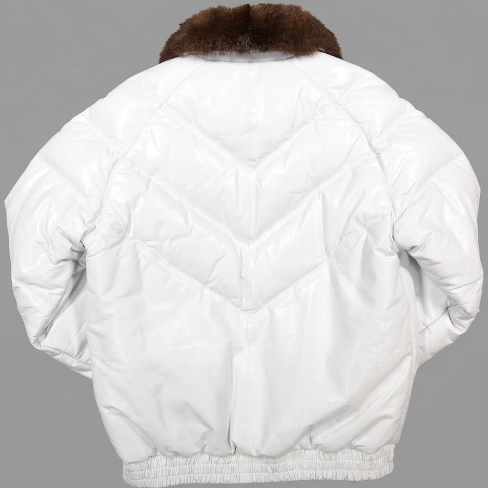 White quilted puffer jacket shown from the back, featuring a brown fox-fur collar and elasticated hem, photographed against a solid gray background.