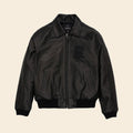 Black leather jacket on a beige background