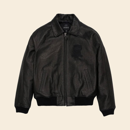 Black leather jacket on a beige background
