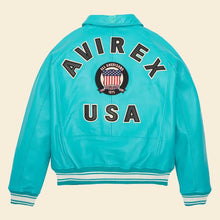 Load image into Gallery viewer, Turquoise jacket with 'Avirex USA' branding on a beige background
