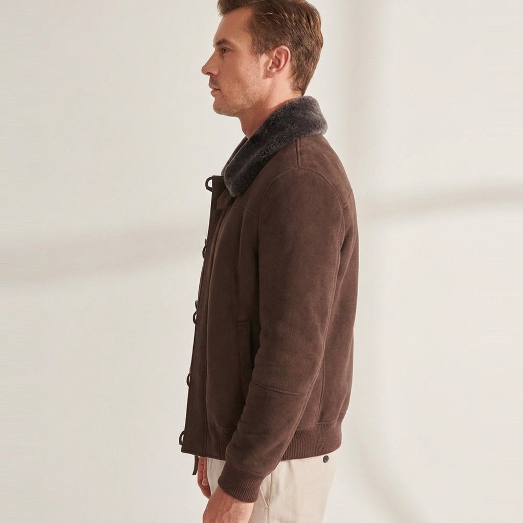 Side view showing the waist-length fit and panelled sleeves