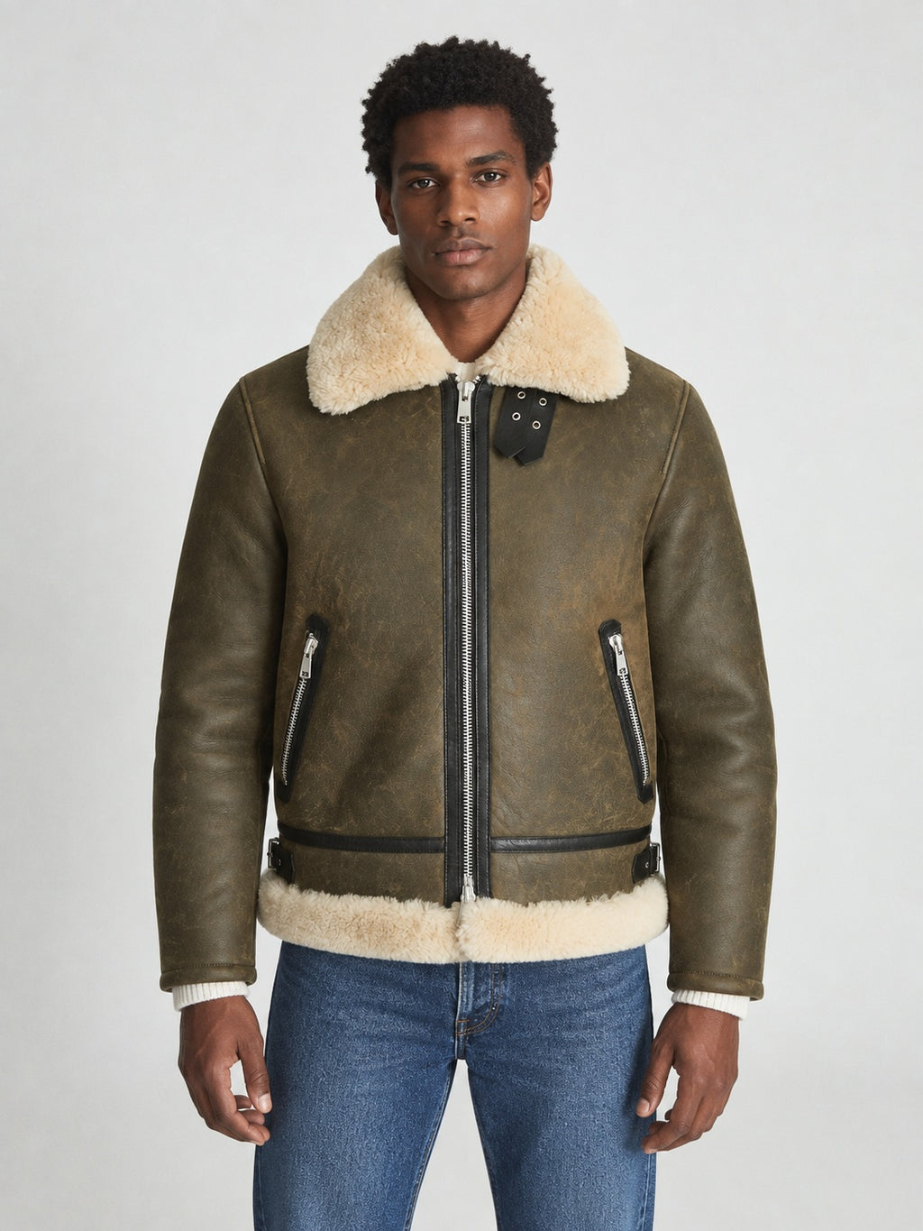 Model wearing men’s army green shearling aviator jacket in a regular hip-length fit