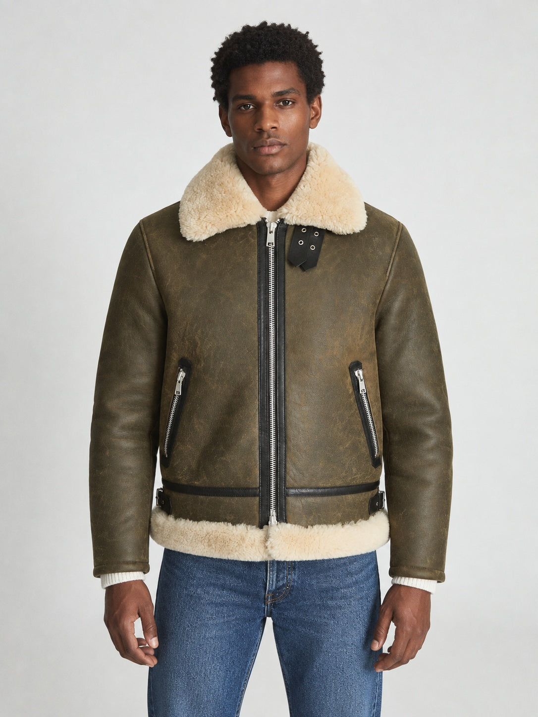 Model wearing men’s army green shearling aviator jacket in a regular hip-length fit