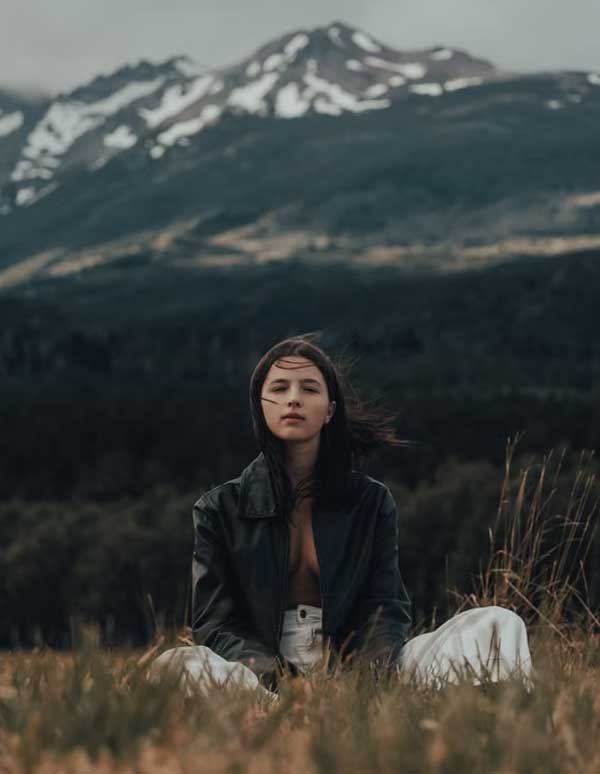 women wearing leather jacket in mountains