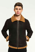 A man wearing a black aviator shearling jacket with a standing collar and zipper details.