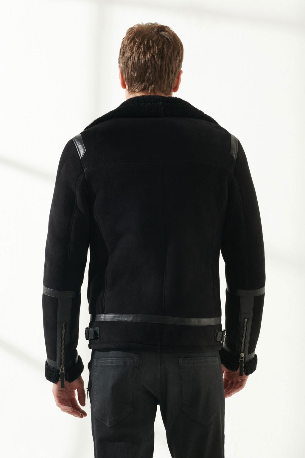 Back view of Men's Aviator Black Shearling Jacket on white background