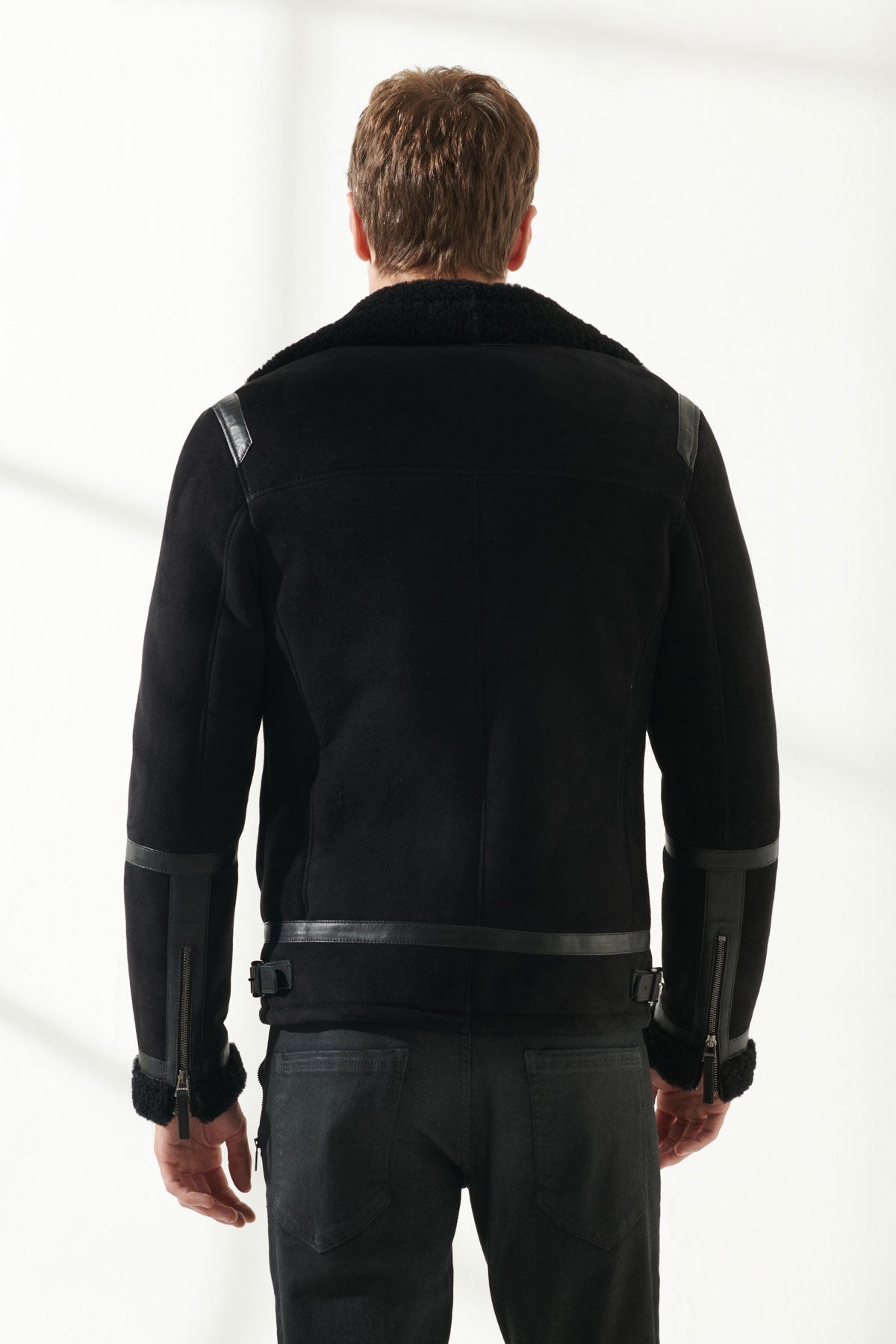 Back view of Men's Aviator Black Shearling Jacket on white background