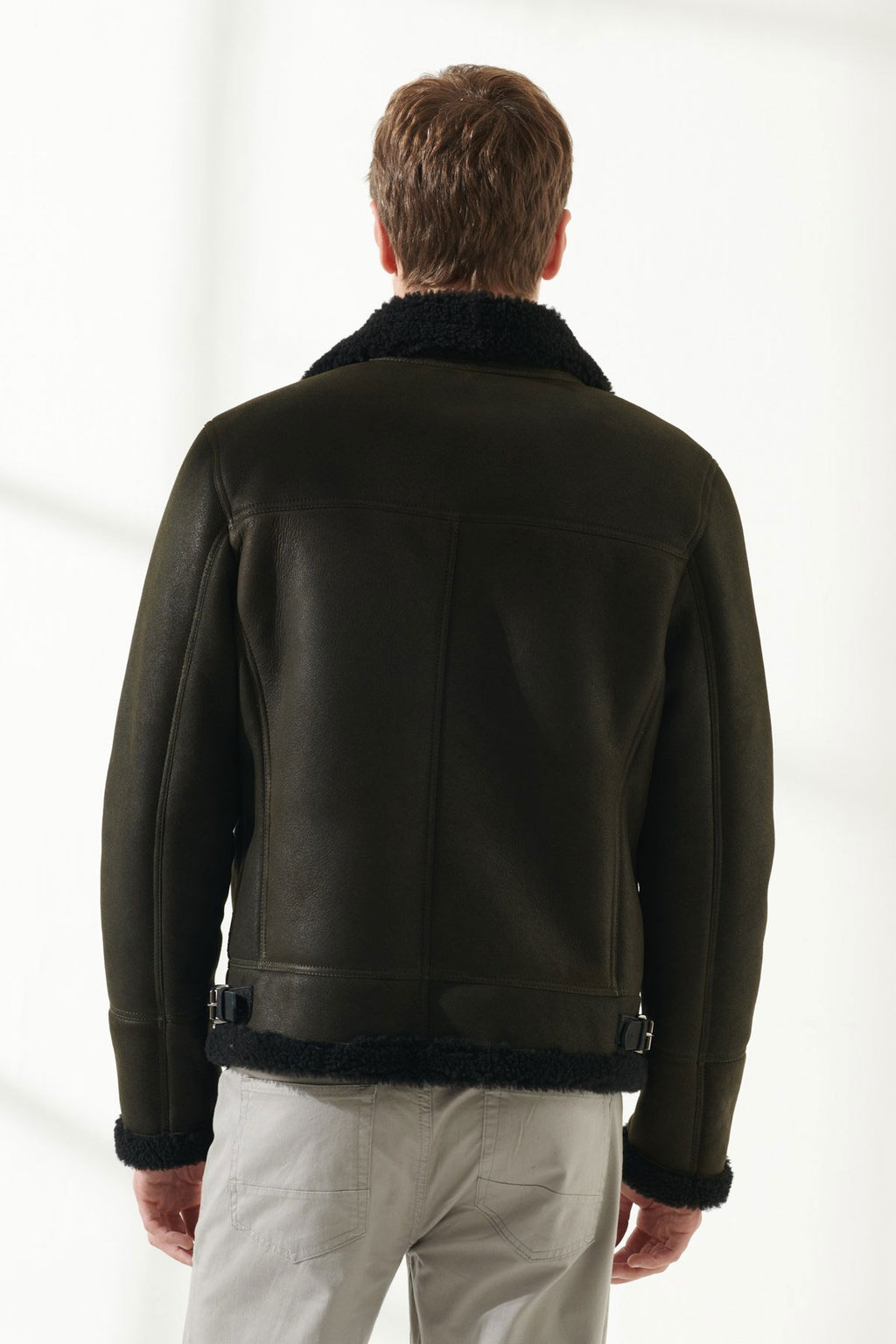back view of dark green shearling jacket