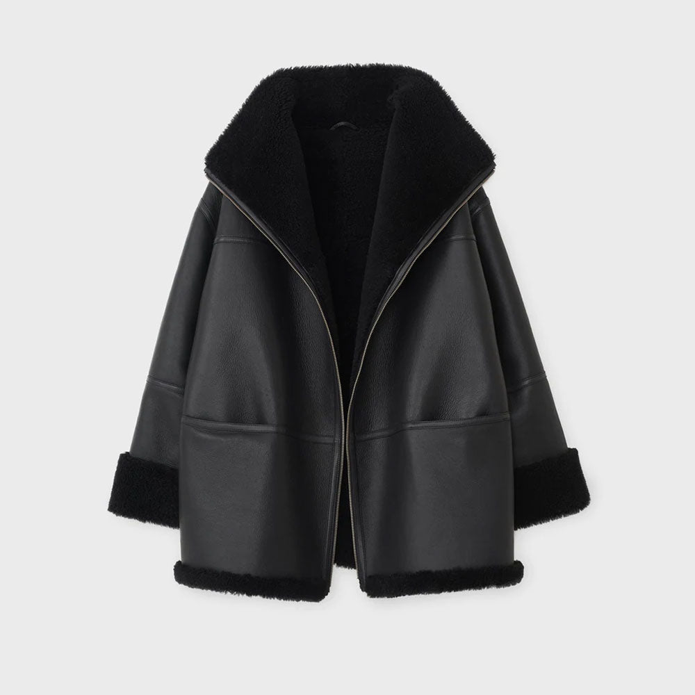 Black sheepskin shearling leather jacket with a high-standing collar, wide lapels, and zip fastening. The jacket is displayed open, showing the interior lining.