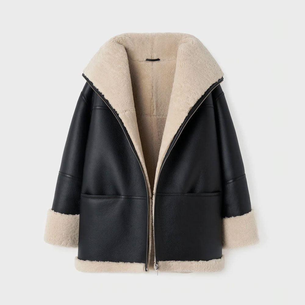 Women's black and beige aviator styled shearling leather jacket with high-standing collar and zip fastening.
