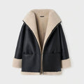 Women's black and beige aviator styled shearling leather jacket with high-standing collar and zip fastening.